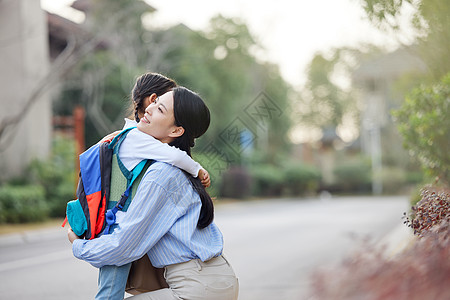 快乐妇女节妈妈送女儿上学背景