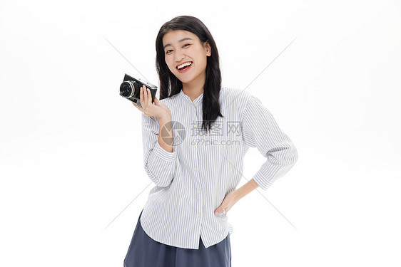 女摄影师拿着复古相机图片