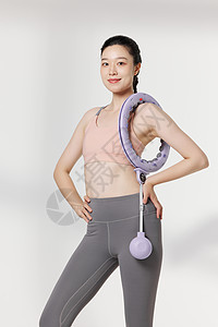 健身女性使用瘦身器材展示动作图片