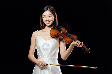 舞台上拉小提琴的优雅美女图片
