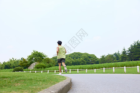 运动场跑步青年男性户外公园跑步背景