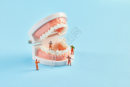 创意小人牙齿口腔修护概念背景图片