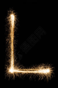 英文大字母L由黑色背景上的燃烧火花制成闪亮的节日派对烟花字体图片
