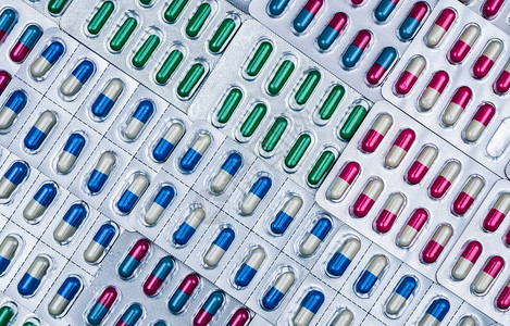 彩色抗菌胶囊丸全药品生产中的质量控制错误泡罩包装缺少一粒抗生素药丸背景图片
