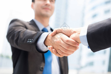 工商界人士握手成功交易问候和商业伙图片