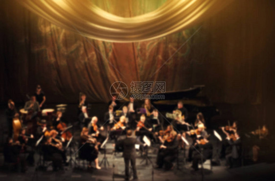 艺术家交响乐团抽象的模糊图像音乐家在音乐会舞台上演奏乐器设计模糊纹理音乐会图片