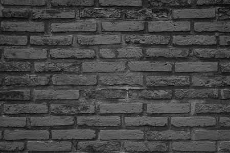 旧式石墙背景黑砖墙抽象粗固纹质地和建筑材料装饰或室内倒置概念的坚固表层背景图片