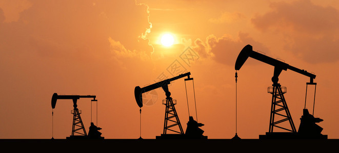 用于设计的日落背景中石油的泵钻机图片