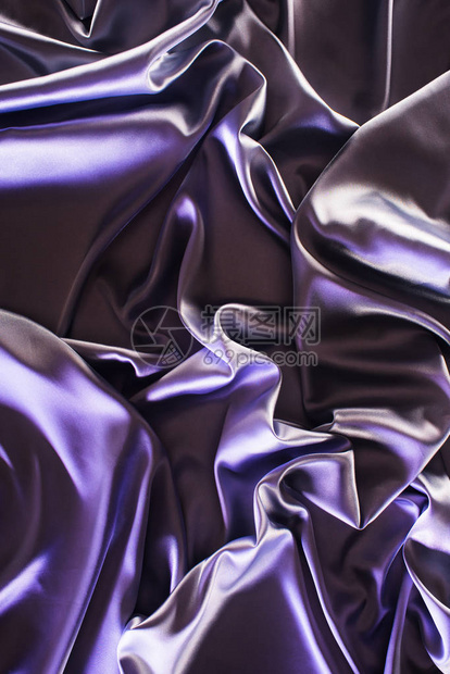 紫外线皱巴的闪亮丝绸面料背景图片