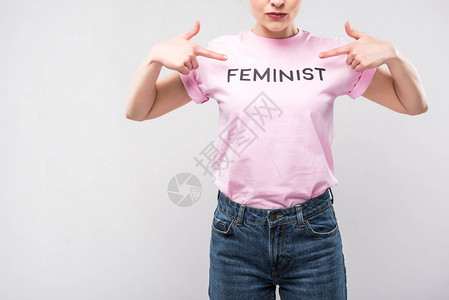 以粉红色女权运动者T恤为指针的在灰图片