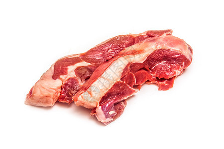 未熟的山羊肉腿牛排孤立在白图片