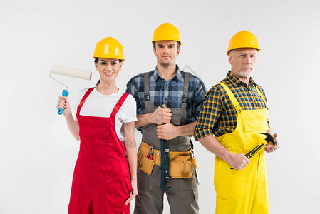 一群职业男女建筑工人微笑着拍白色隔绝的图片