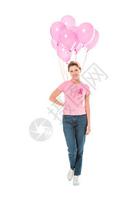女人拿着粉色气球对着被白色乳腺癌概念隔图片