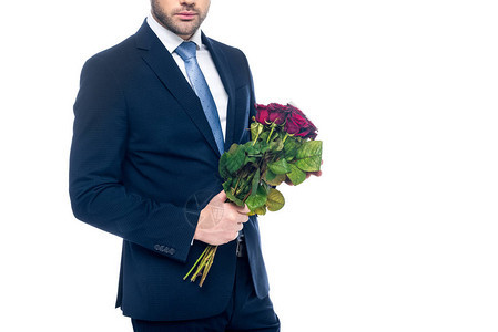 高雅男子拿着红玫瑰花束的光辉风景在图片