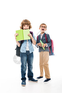 兴奋的小学生背着书包和书被白色隔离图片