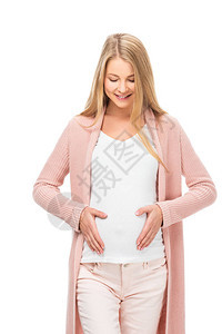 怀着微笑的怀孕金发孕妇用双手抚摸腹部图片