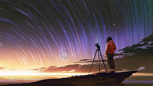 年轻摄影师拍摄日出天空图片
