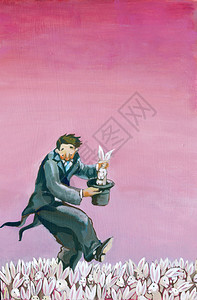 一个魔术师把兔子从圆筒里拉出来图片