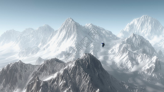 热气球飞越冬季山地景观图片