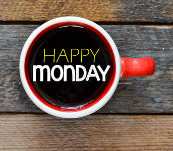 星期一快乐的咖啡杯在木图片