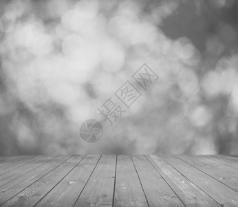 黑色和白色的灰色散景和木地板背景图片