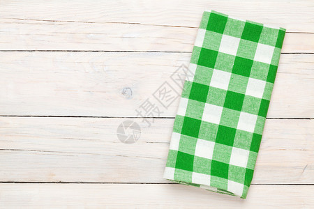 绿色毛巾在木制桌上方从上面看图片