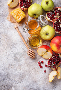 RoshHashana的蜂蜜苹果和石榴图片