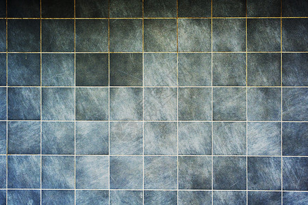 方形灰色斑驳墙砖的抽象几何建筑背景方形灰色斑驳墙砖的抽象图片