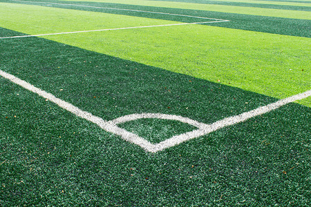 足球场的白色角线角球的足球场白色角线背景图片