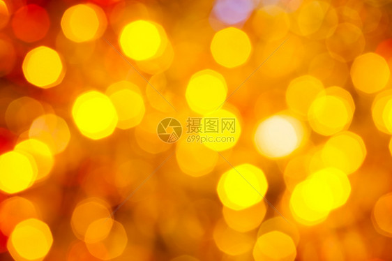 抽象的模糊背景Xmas树上电藻园的圣诞灯光照亮的棕色图片