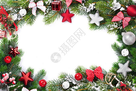 圣诞框架背景与小玩意星和弓雪冷的枞树图片