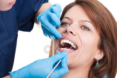 口腔检查由牙医妇女对有完美牙图片