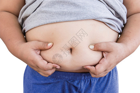 男孩脂肪和不健康在孤立的白图片