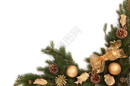 圣诞边框有金黄弓和霍利装饰品松果和葡萄叶图片