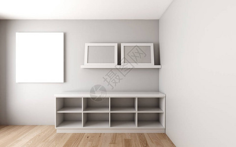 在白色墙壁和木制地板上装有空白边框的橱柜图片