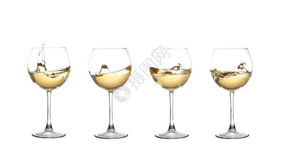 白色的白葡萄酒在玻璃杯中挥发以图片
