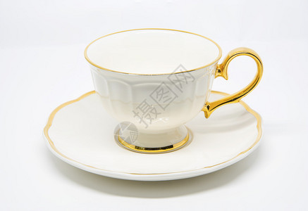 白色背景上的古董瓷茶杯图片
