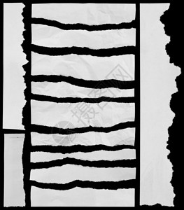 在黑色的撕碎的纸片图片