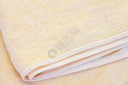 干净的黄色毛巾质地和无缝背景特写图片