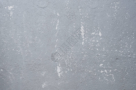 混凝土墙上涂有划痕和遇险纹理的灰色旧布料背景摘要图片