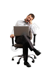 疲倦的商人坐在办公椅上打呵欠图片