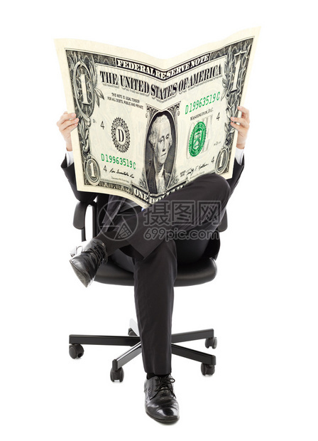 商人坐在一把美国货币的椅子上手图片