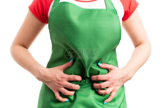 女超市员工手抓腹胀的特写镜头作为痛苦的消化不良胃问题概念在白色图片