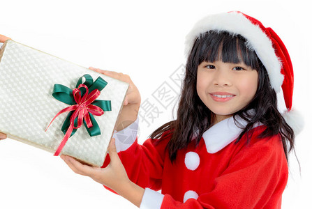 服装小女孩的肖像得到圣诞礼背景图片