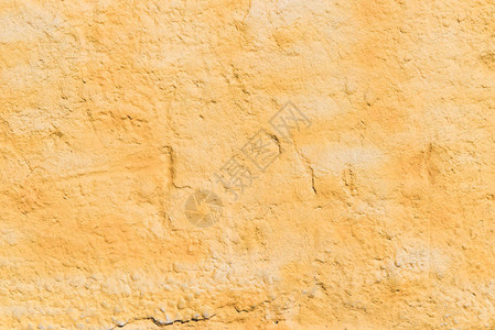 粗糙风化的橙色墙壁纹理背景图片