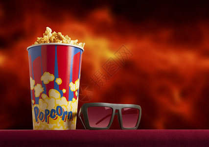 红色扶手椅电影院上的3d眼镜和爆米花轰动一时的概念图片