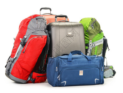 行李包括大型行李箱背包和白色的孤立旅图片