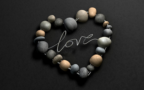 由铁丝和石头制成的心形用爱这个词图片