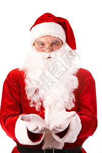 张开手掌看着相机的快乐圣诞老人的照片图片