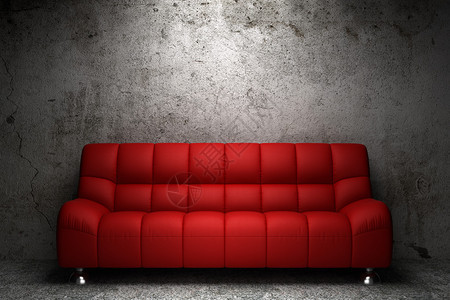 在grunge混凝土墙前的红色真皮沙发背景图片